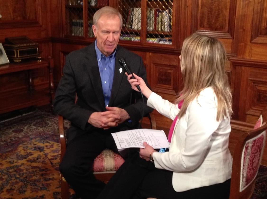 Gov. Bruce Rauner spent much of his anniversary in office giving brief media interviews, including with Illinois Public Radio. 