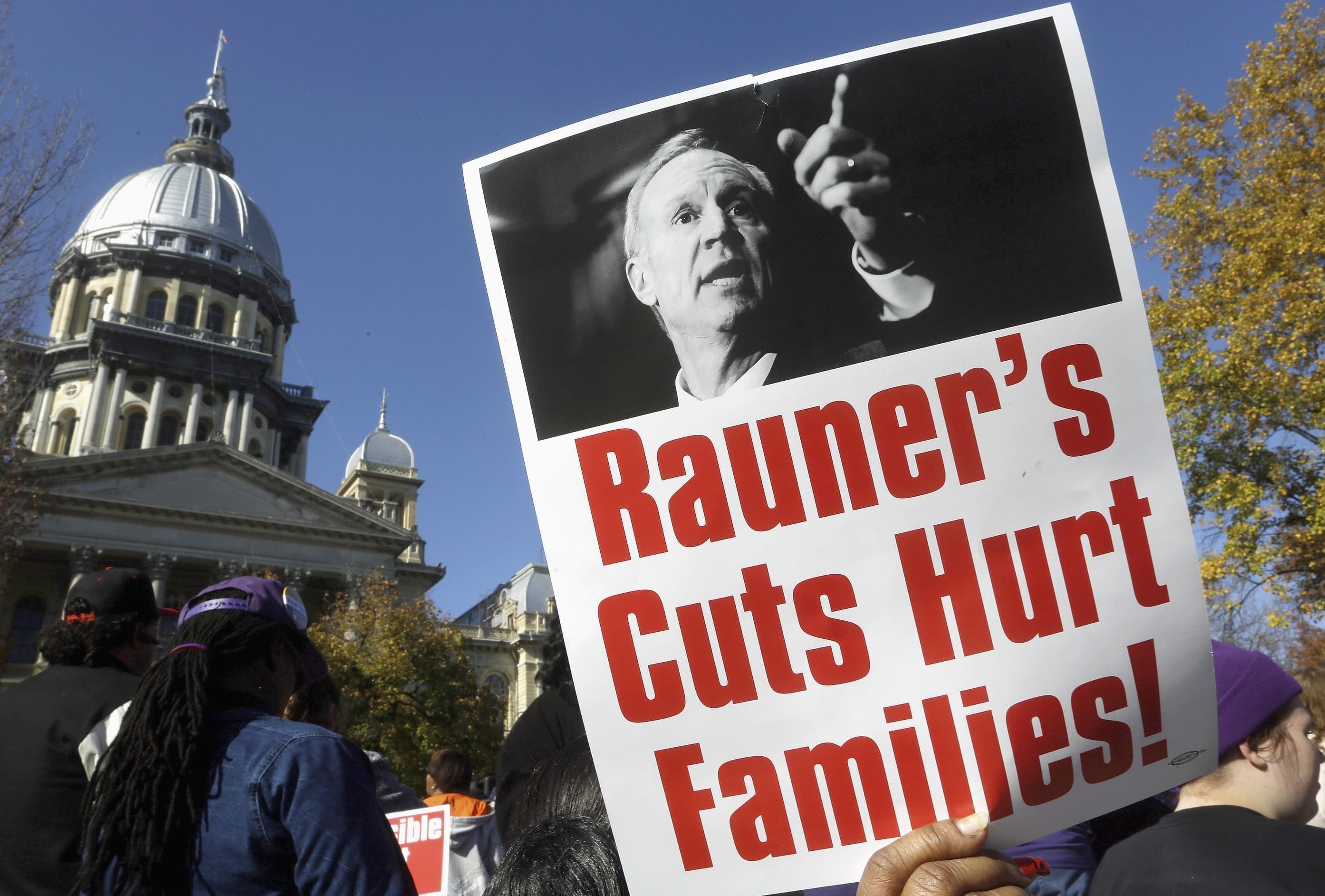 In this Nov. 10, 2015 file photo, protesters rally in support of lawmakers ending the state budget impasse at the Illinois state Capitol in Springfield.