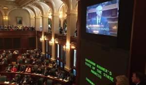 Illinois Gov. Bruce Rauner is seen on a video monitor at the Illinois Statehouse as he delivers his State of the State address