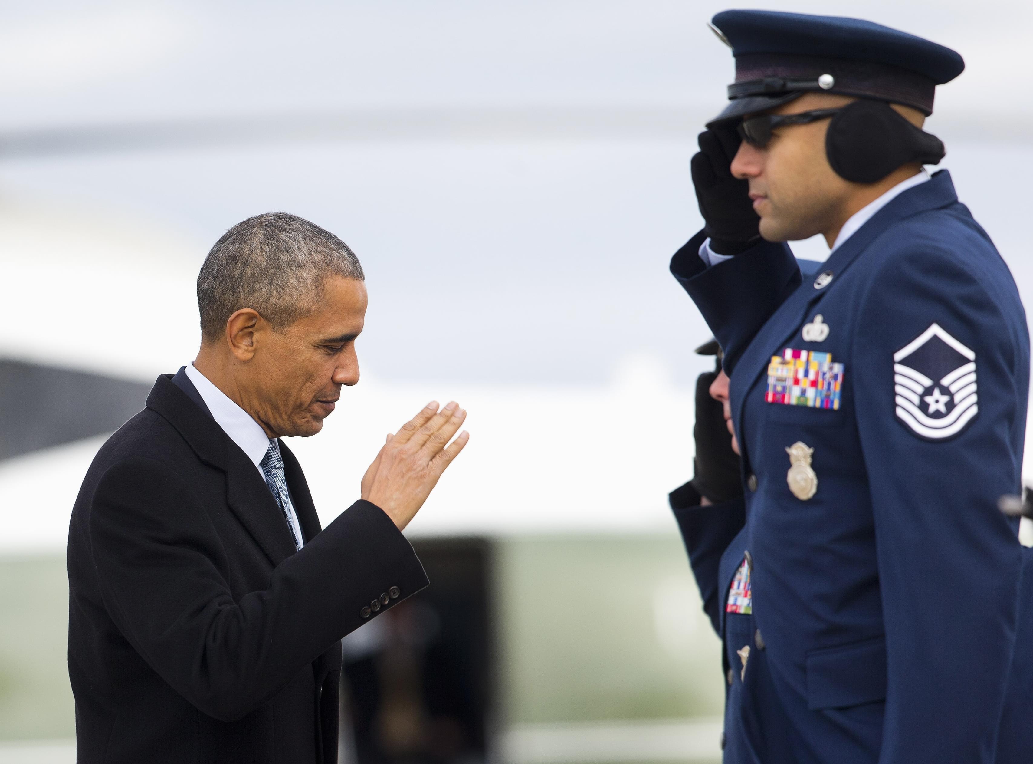 President Barack Obama returns a salute as he boards Air Force One before his departure from Andrews Air Force Base, Md.,Wednesday. He's headed to Springfield.