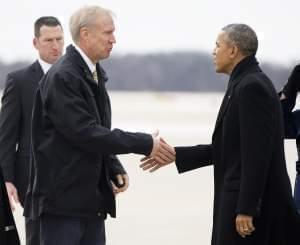 President Barack Obama is greeted by Illinois Gov. Bruce Rauner on the tarmac during his arrival on Air Force One at Abraham Lincoln Capitol Airport in Springfield Wednesday.