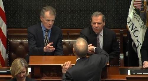 Gov. Bruce Rauner shakes hands with the General Assembly's Democratic leaders, House Speaker Michael Madigan and Senate President John Cullerton.