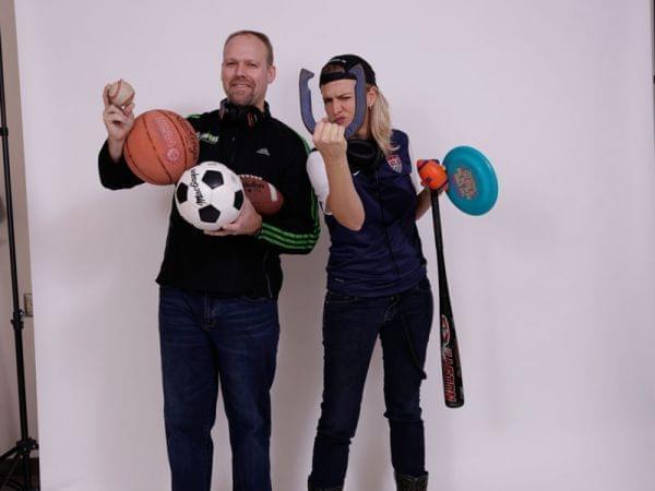 Brian Moline and Lisa Bralts holding all sorts of sports equipment