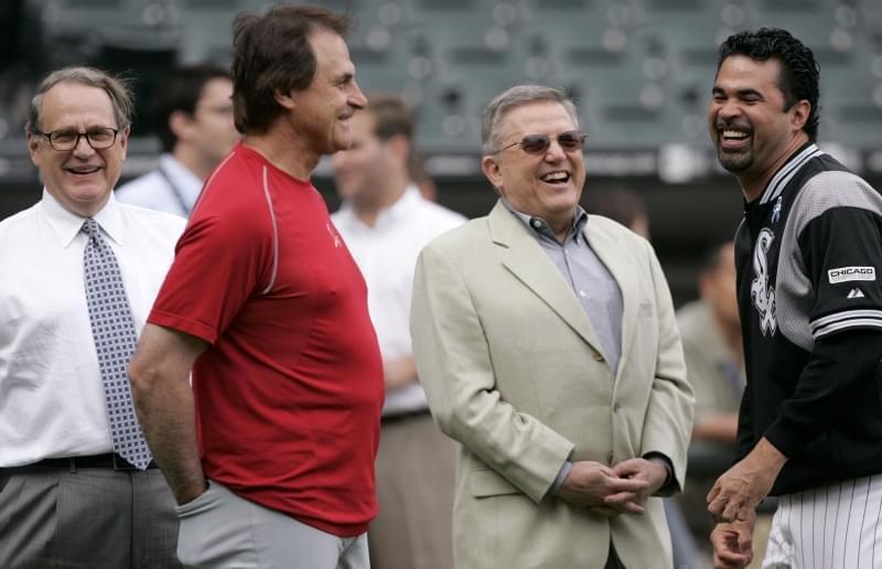 Chicago White Sox chairman Jerry Reinsdorf, left, manager Ozzie Guillen, right, vice chairman Eddie Einhorn, center right, and former St. Louis Cardinals manager Tony La Russa talk before a baseball game between the two clubs in Chicago, Tuesday, Jun