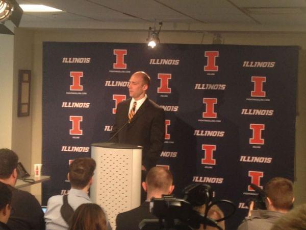 Illinois athletic director Josh Whitman answering questions in a news conference.