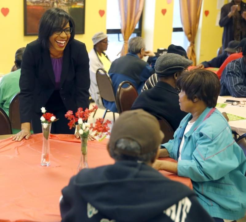 In this Feb. 12, 2016 photo, Democrat Juliana Stratton talks to residents during a bingo party at the Minnie Ripperton apartments in Chicago.Stratton, is trying to unseat incumbent Democratic state Rep. Ken Dunkin. “