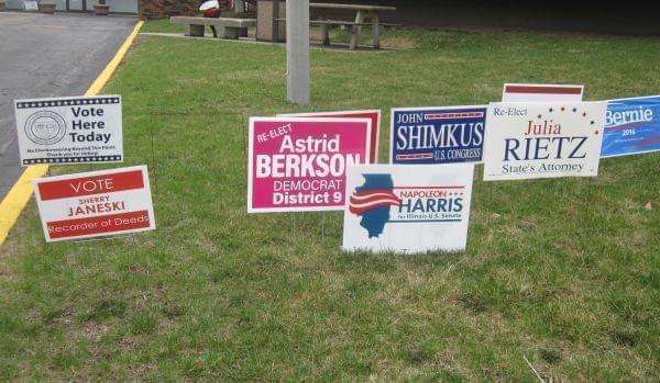 Campaign signs in front of the Brookens Administrative Center  