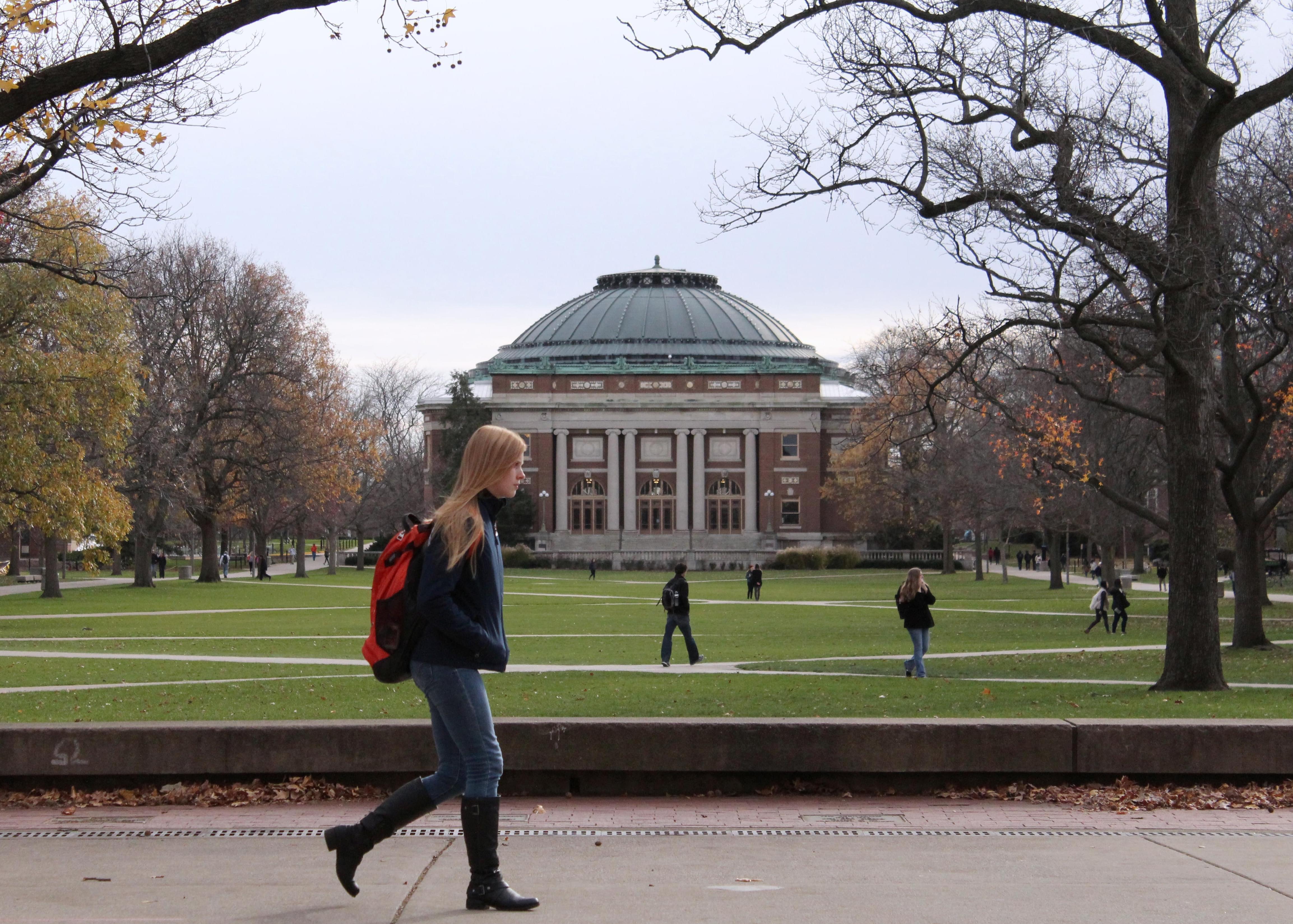 In this Nov. 20, 2015 file photo, University of Illinois students walk across the Main Quad on campus in Urbana.
