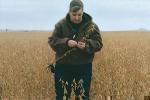 Lynn Rohrscheib inspects her soybean fields. 