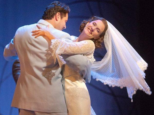 Bride and groom dancing on stage