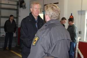 Gov. Bruce Rauner meets with other state and local officials when surveying flood damage in Villa Grove January 3.