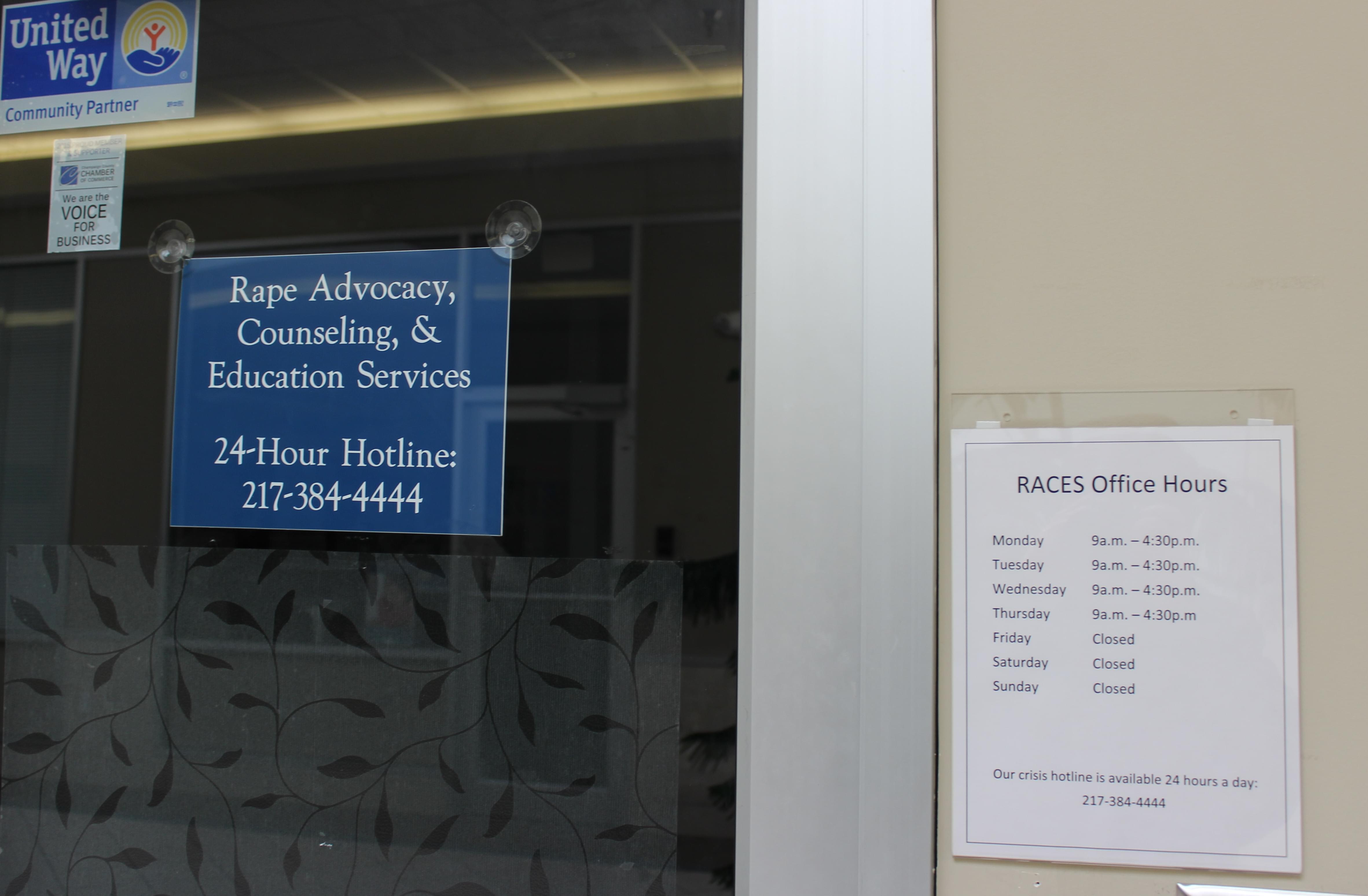 Signs on the door for the RACES agency in Urbana.