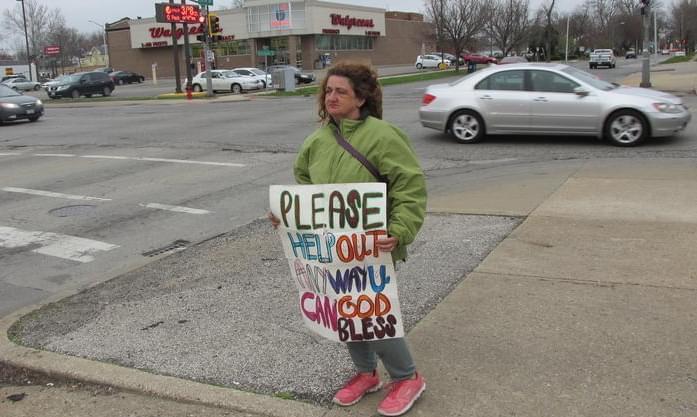 Panhandler Karen Otterson at a street corner in Springfield.