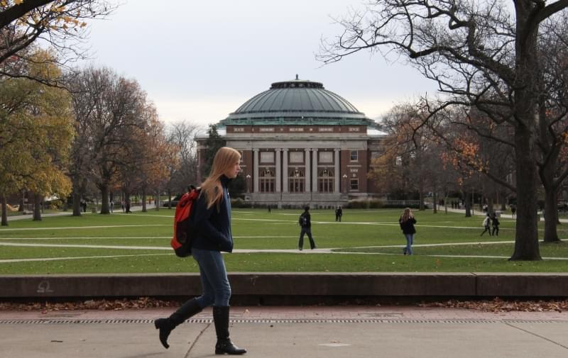 In this Nov. 20, 2015 photo, University of Illinois students walk across the Main Quad on campus in Urbana.