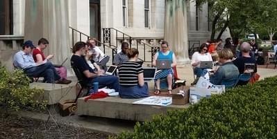 Members of the Non-Tenure Faculty Coalition hold a 'work-in' outside the Henry Administration Building.