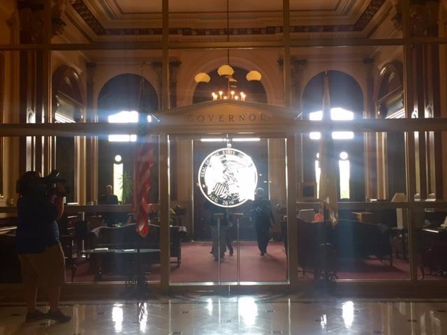 Michael Madigan walking into the governors office.