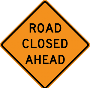"Road Closed Ahead" highway sign. 