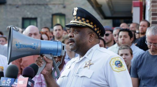 Chicago Police Superintendent Eddie Johnson speaks with members of LGBT groups and their supporters at a vigil in the city's Lakeview neighborhood on Sunday. 