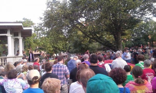 A crowd at West Side Park in Champaign remembers the shooting victims in Orlando.