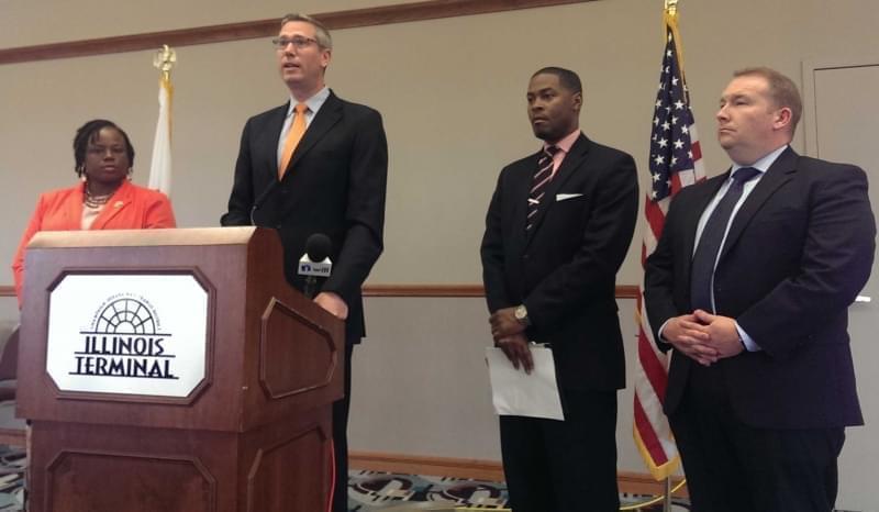 State Treasurer Mike Frerichs, joined by State Rep. Carol Ammons, AARP Associate Director Andre Jordan, and Senator Scott Bennett at the Illinois Terminal in Champaign.
