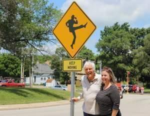 Dick Van Dyke is joined by his wife Arlene with the unveiling of the 'Keep Moving' street sign outside Danville High School.