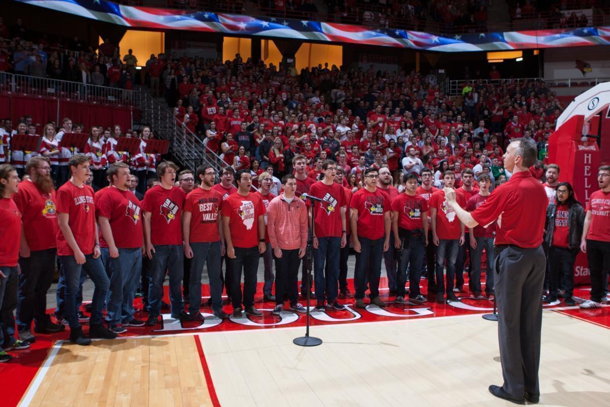 Mark Grizzard directing the ISU Mens Glee Club at Redbird Arena