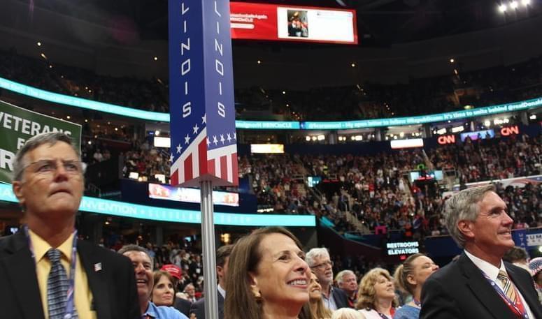 Illinois Republican National Committeewoman Demetra Demonte and state party chairman Tim Schneider on the floor for the first night of the Republican National Convention in Cleveland.