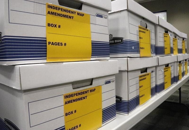 In this May 6, 2016, file photo, boxes are stacked that will hold signature petitions at the Illinois State Board of Election office in Springfield, Ill. 