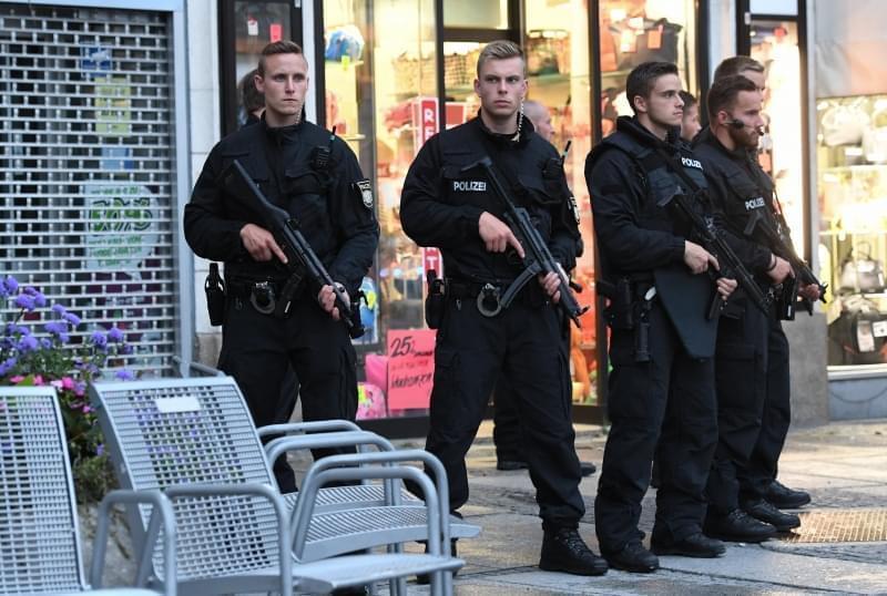 Police officer secure the Stachus hotel after a shooting was reported at a nearby shopping mall in Munich, 