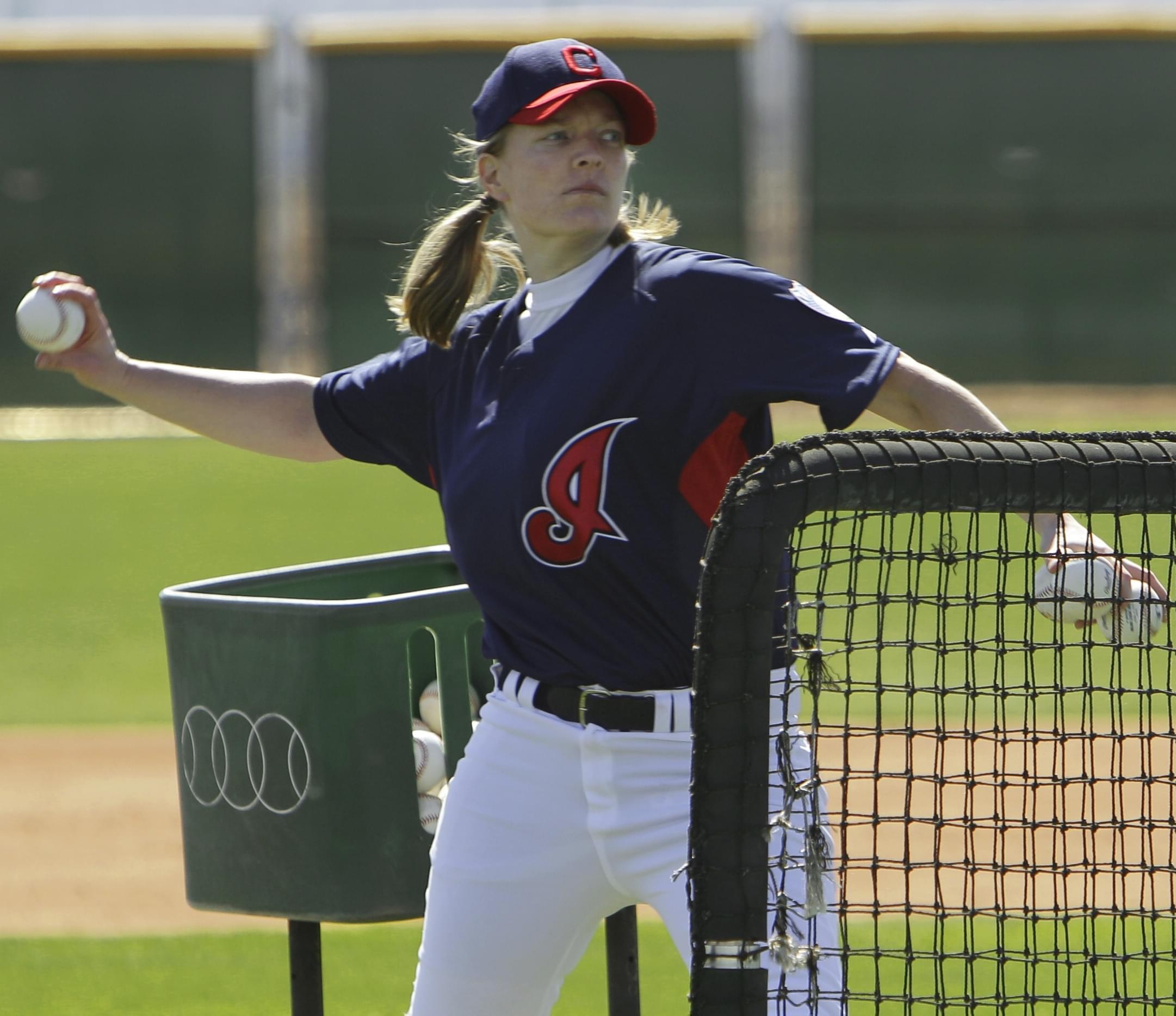 Justine Siegal throws batting practice to Cleveland Indians catchers during baseball spring training Monday, Feb. 21, 2011, in Goodyear, Ariz.