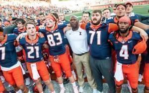 Illinois head coach Lovie Smith, center, sings the alma mater with the team after Illinois defeated Murray State 52-3 in an NCAA college football game Saturday, Sept. 3, 2016 at Memorial Stadium in Champaign.