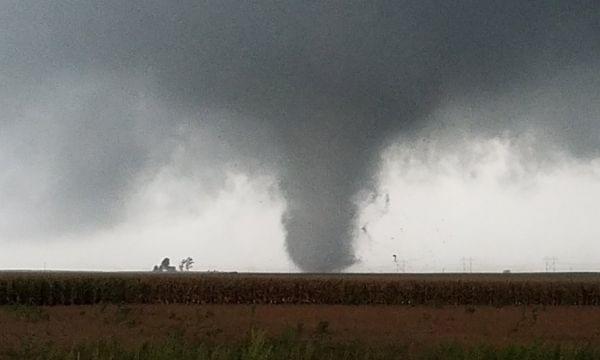 Image of tornado hitting a structure Southwest of Homer.