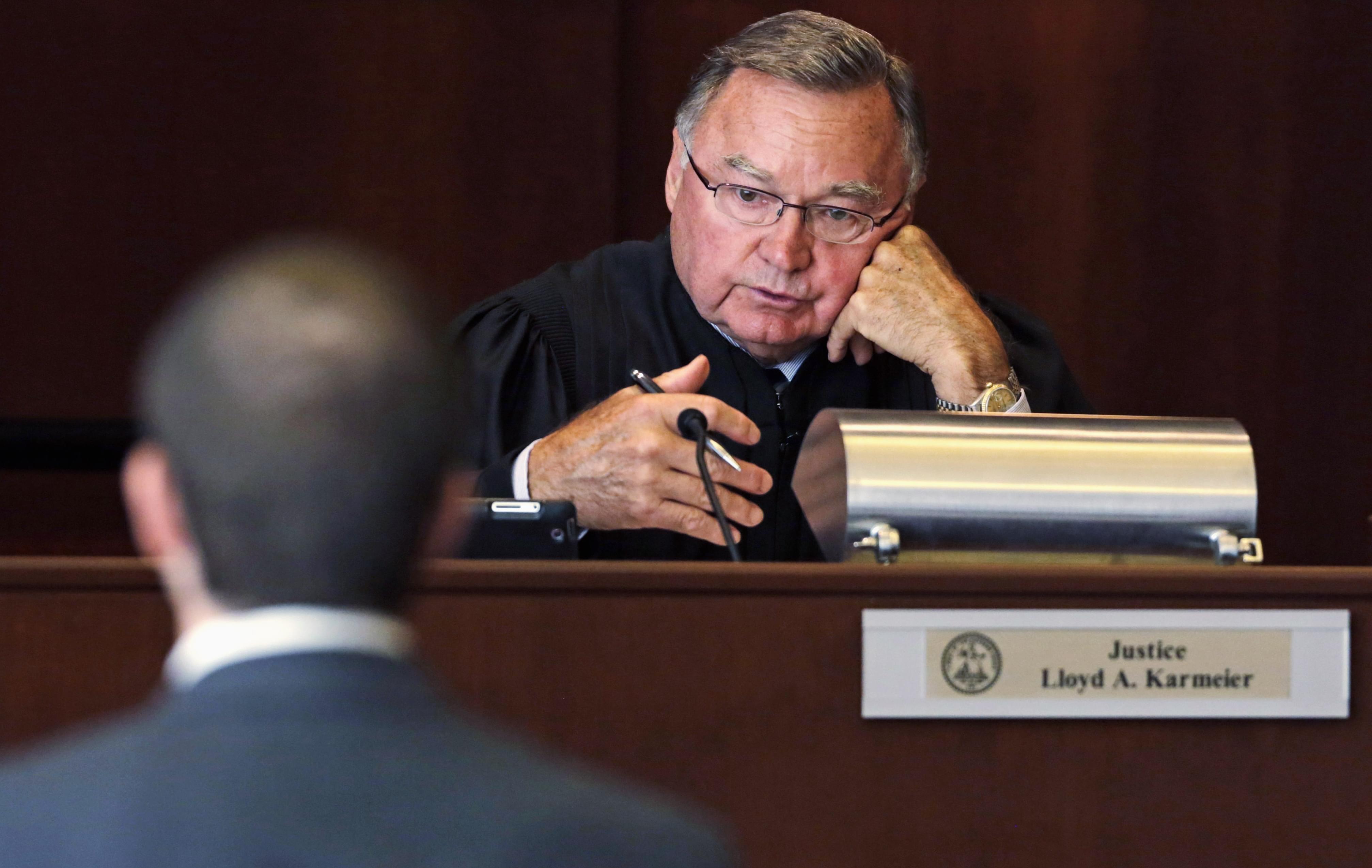Illinois Supreme Court justice Lloyd A. Karmeier questions an attorney during oral arguments in Chicago. 