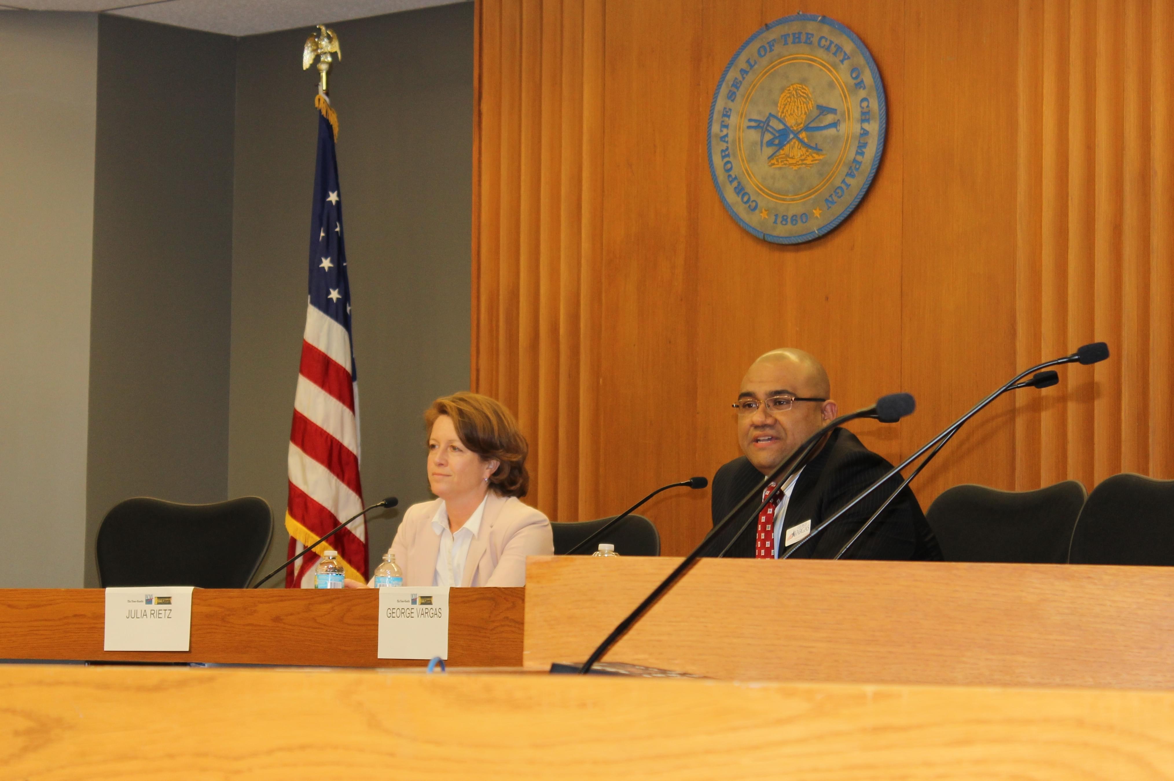 Champaign County State's Attorney Julia Rietz and Public Defender George Vargas debate during Tuesday's forum in the Champaign City Council chambers.