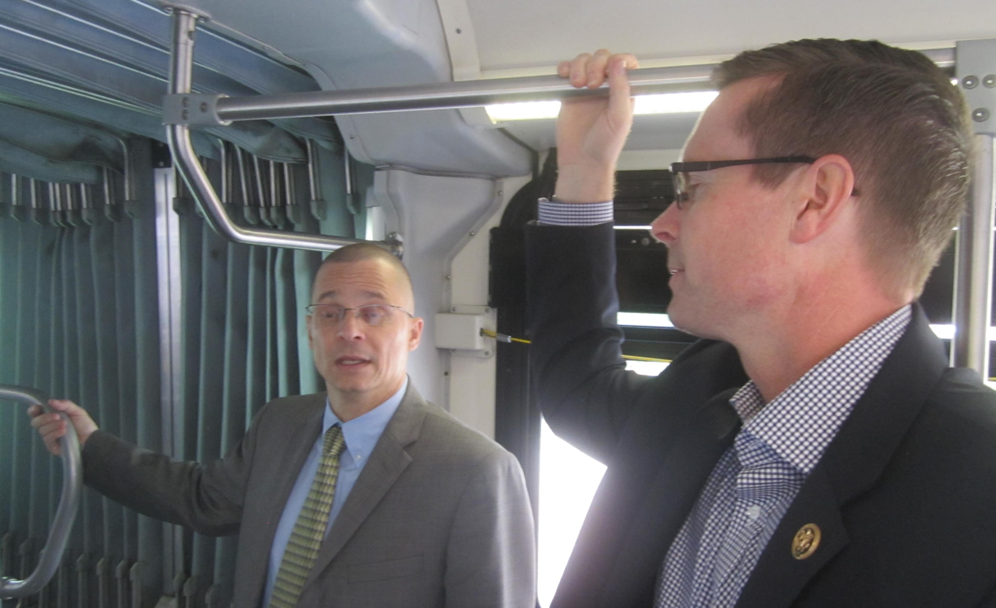 U.S. Rep. Rodney Davis rides a C-U Mass Transit bus with CUMTD managing director Karl Gnadt.