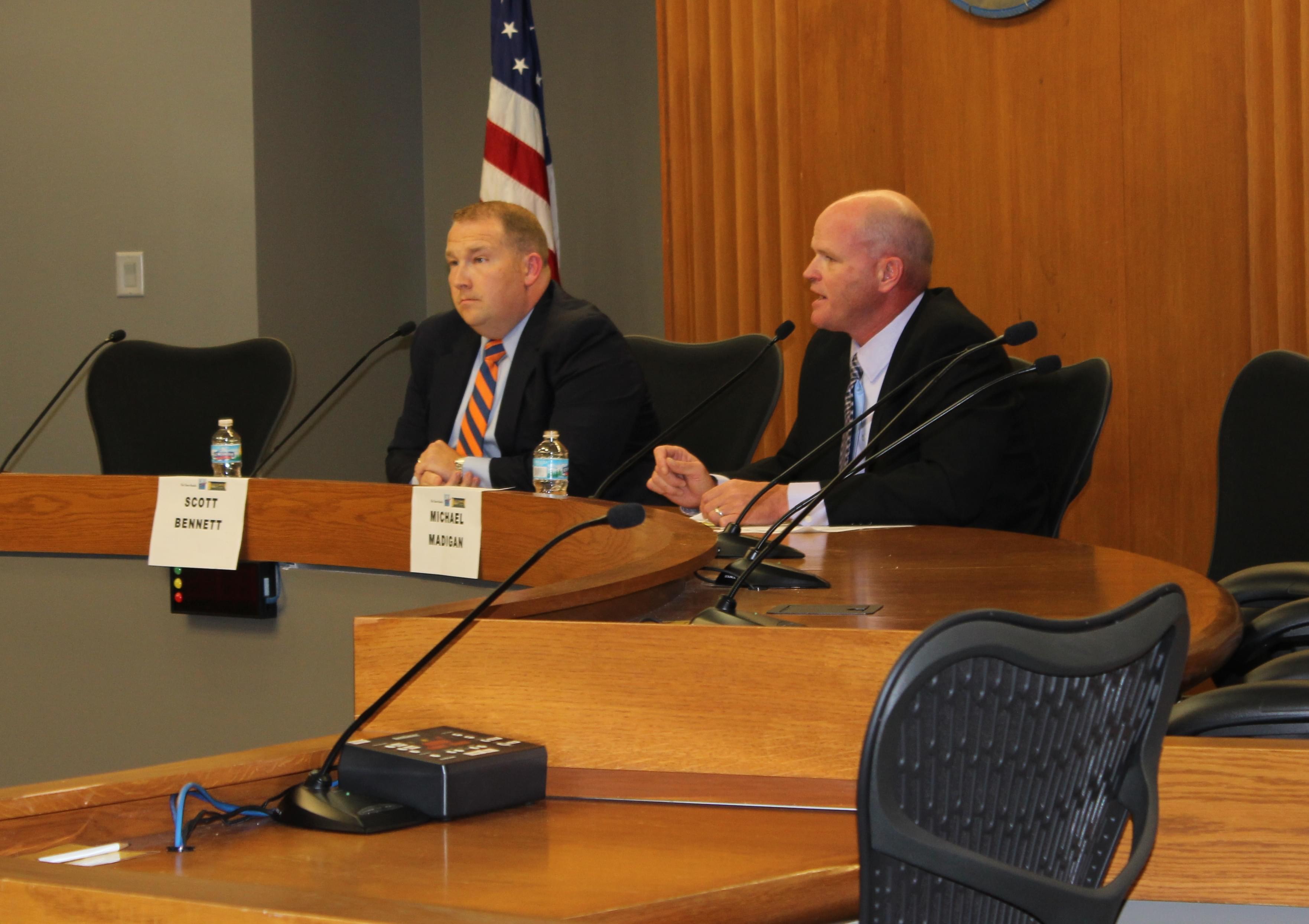 Senator Scott Bennett (D) and Republican Urbana Alderman Mike Madigan debate during Wednesday's forum at the Champaign City Building.  