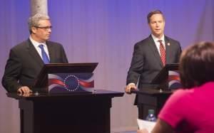 Democrat Mark Wicklund and incumbent Republican Congressman Rodney Davis debate one another Thursday at the WILL-TV studios.
