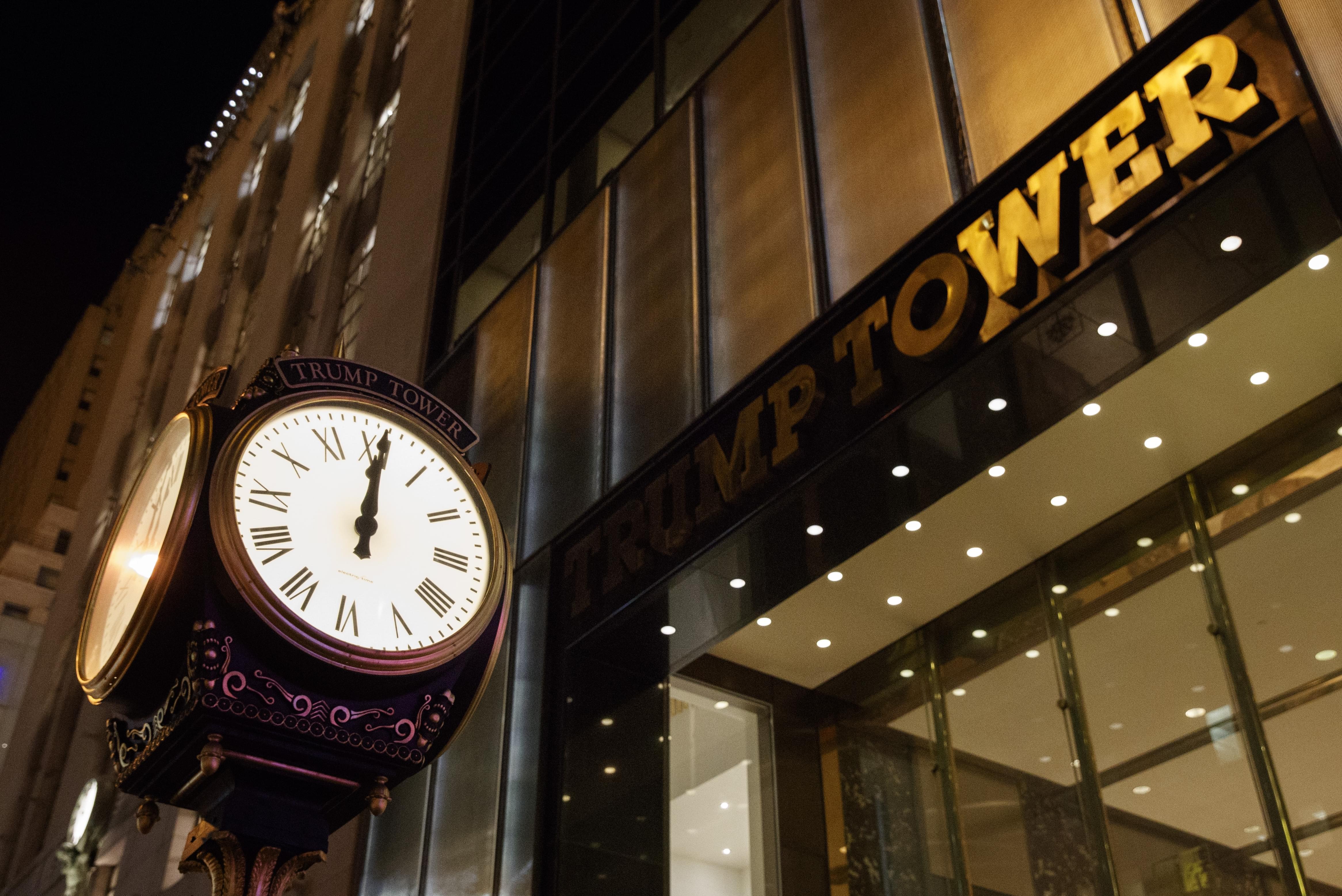 A clock sits outside of Trump Tower at midnight on, Saturday, Oct. 8, 2016, in New York.