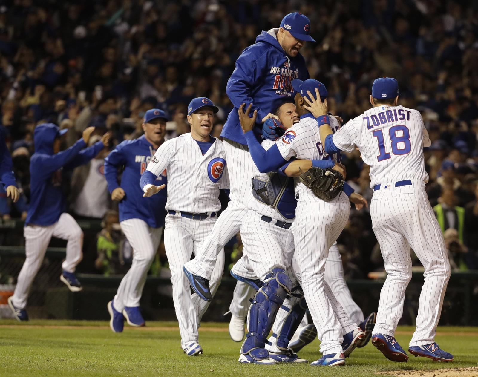 Cubs players celebrating after winning the 2016 National League pennant.