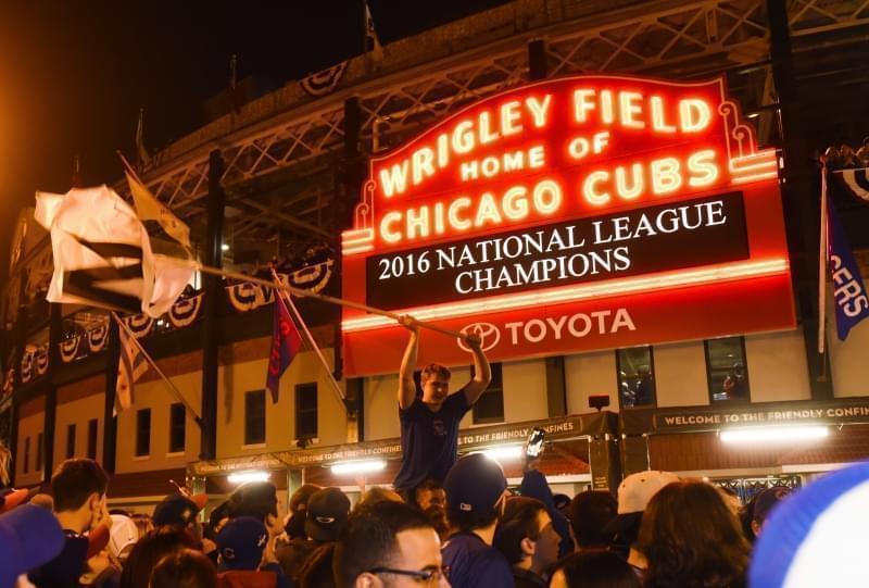 Chicago Cubs fans celebrate outside Wrigley Field after the Cubs defeated the Los Angeles Dodgers 5-0 in Game 6 of baseball's National League Championship Series, Saturday, Oct. 22, 2016, in Chicago. The Cubs advanced to the World Series. 