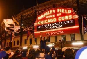 Chicago Cubs fans celebrate outside Wrigley Field after the Cubs defeated the Los Angeles Dodgers 5-0 in Game 6 of baseball's National League Championship Series, Saturday, Oct. 22, 2016, in Chicago. The Cubs advanced to the World Series. 