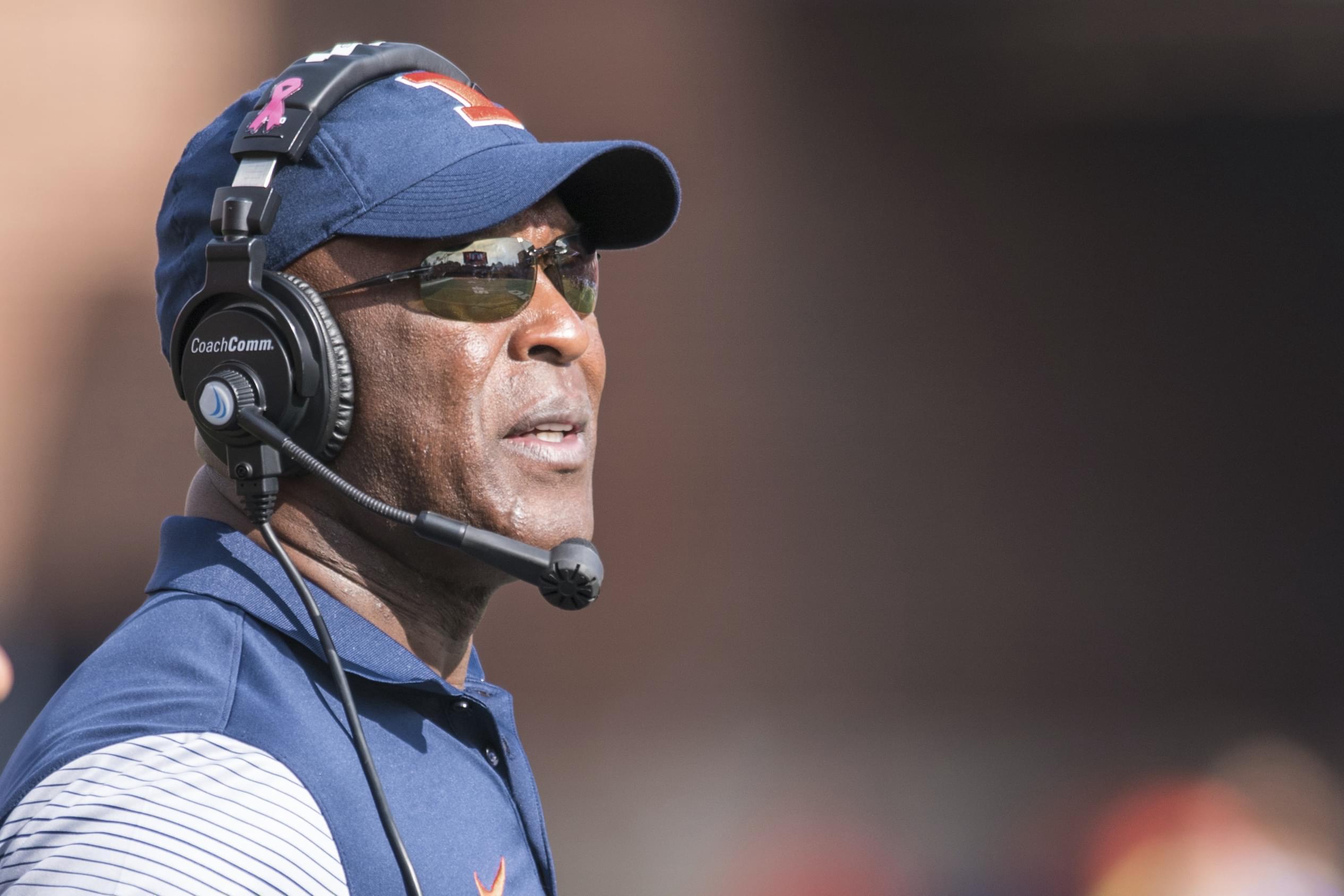 Illinois head coach Lovie Smith looks at the scoreboard during the second quarter of an NCAA college football game against Minnesota, Saturday, Oct. 29, 2016, at Memorial Stadium in Champaign