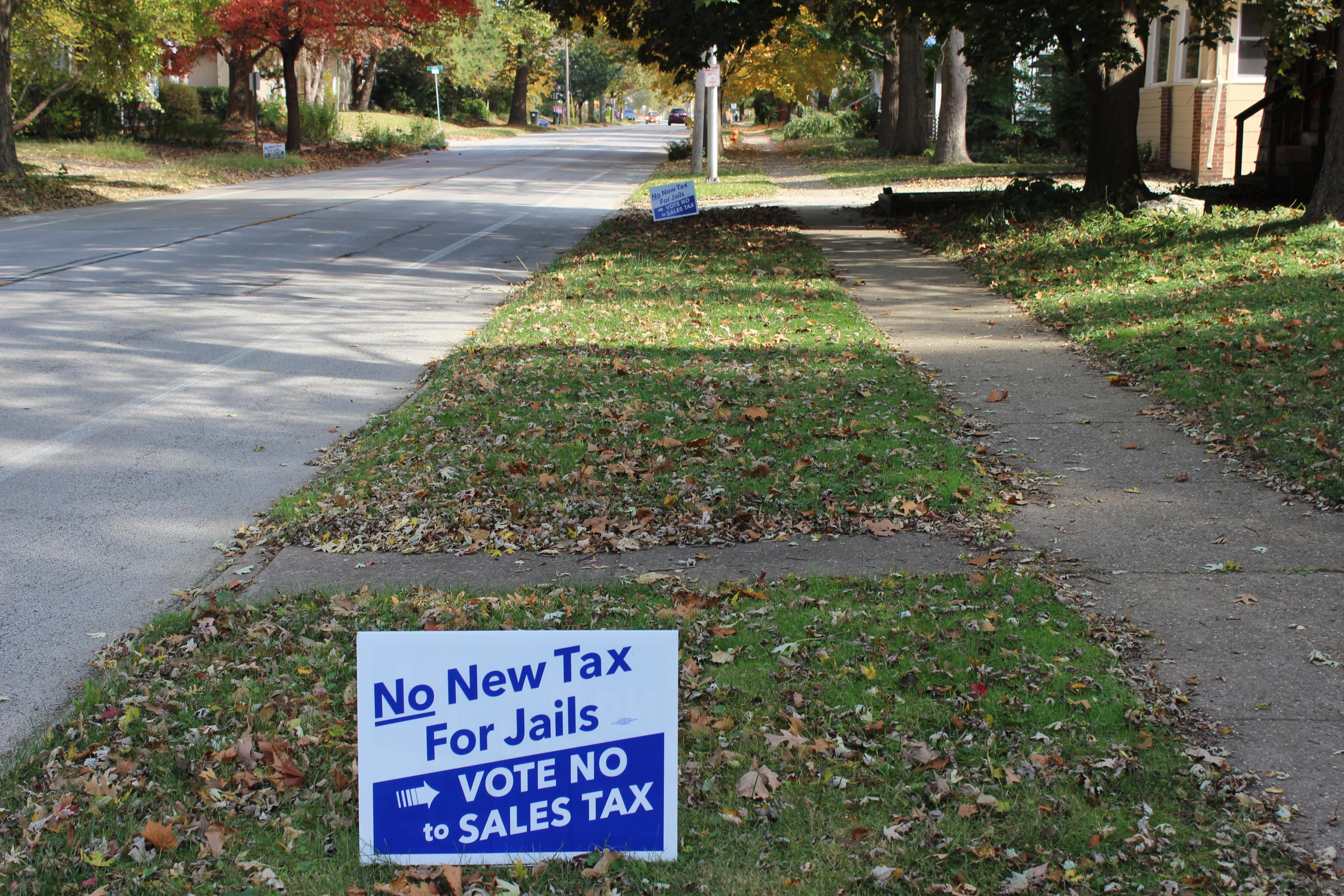 Two yard signs in Urbana show opposition for proposed sales tax increase for facilities projects.