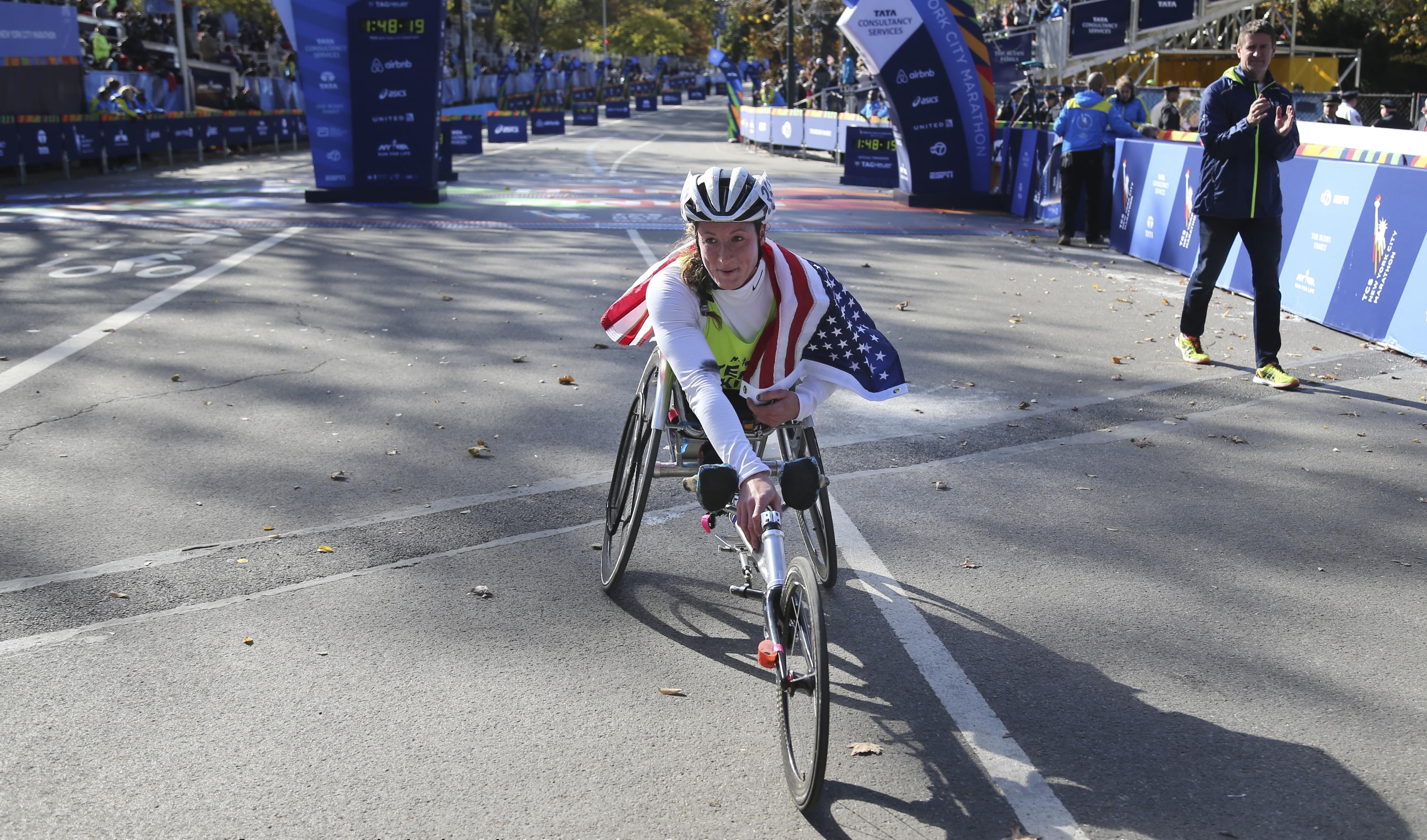 U of I graduate
tatyana McFadden poses for pictures after winning the women's wheelchair division at the 2016 New York City Marathon.