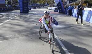 U of I graduate 
tatyana McFadden poses for pictures after winning the women's wheelchair division at the 2016 New York City Marathon.