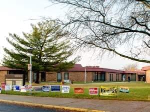 Campaign signs lined  up outside the entrance to the Champaign County Clerk's office in Urbana.