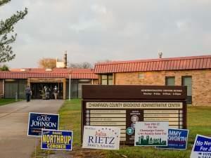 Campaign signs lined  up outside the entrance to the Champaign County Clerk's office in Urbana.