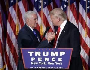 President-elect Donald Trump shakes hands with Vice President-elect Mike Pence as he gives his acceptance speech during his election night rally, Wednesday, Nov. 9, 2016, in New York.