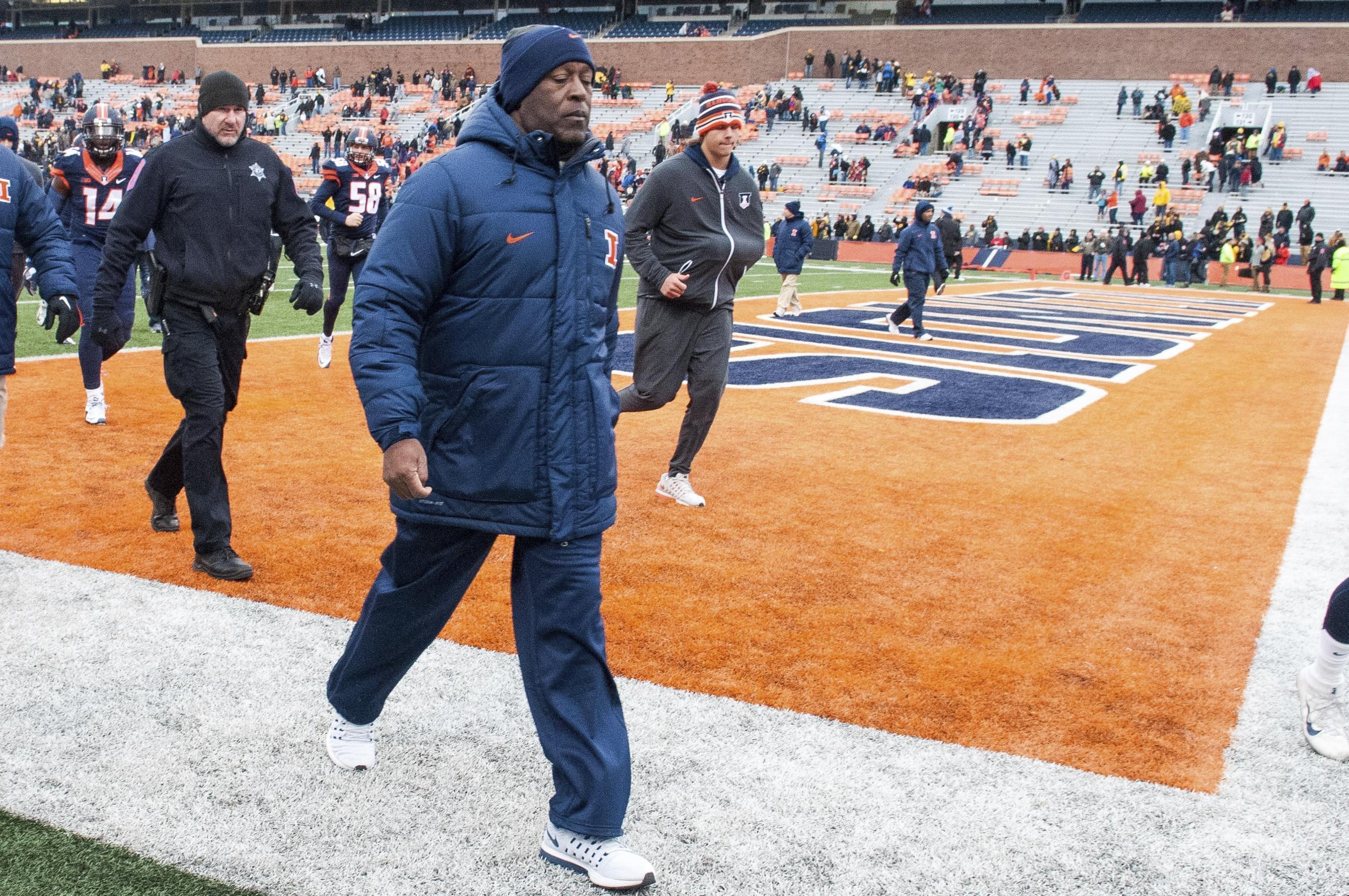 Illinois head coach Lovie Smith walks off the field after being defeated by Iowa 28-0 in an NCAA college football game, Saturday, Nov. 19, 2016 at Memorial Stadium in Champaign, Ill. 