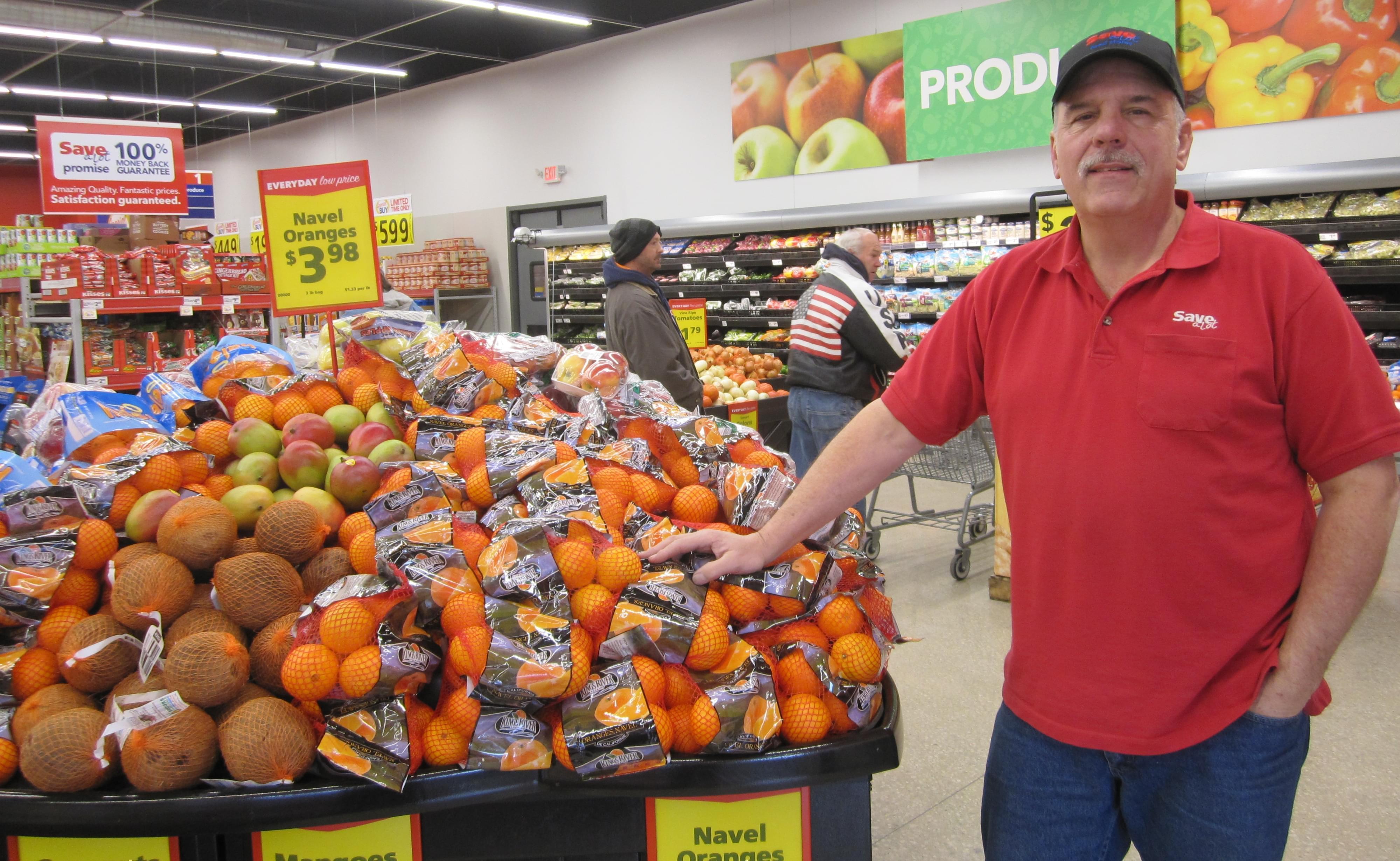 Dave Jackson stands in the produce section of his new and larger Save-A-Lot store in downtown Clinton.